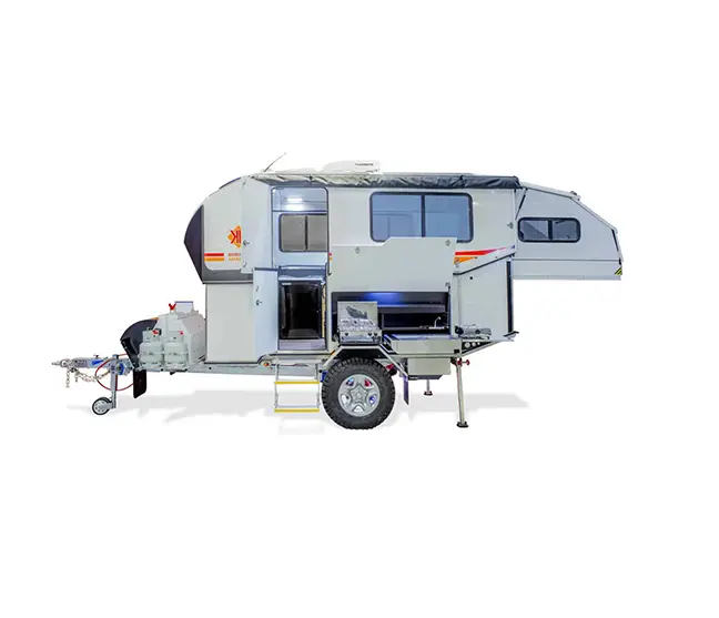 A small camper trailer with a bed on the back.