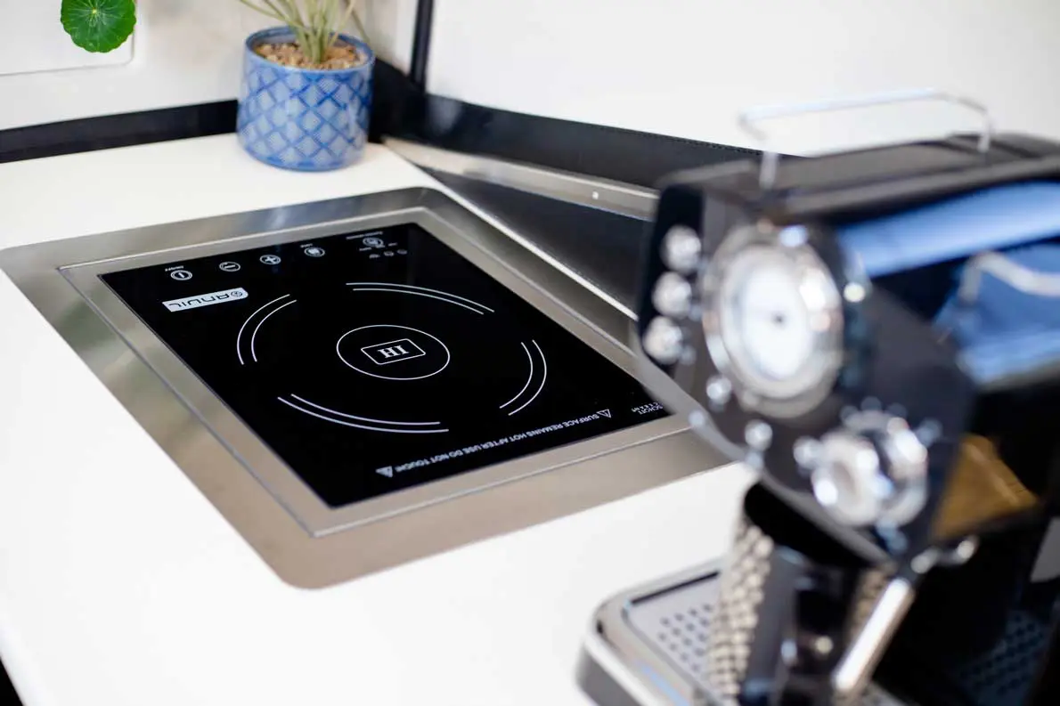 A black and white photo of an electric stove.