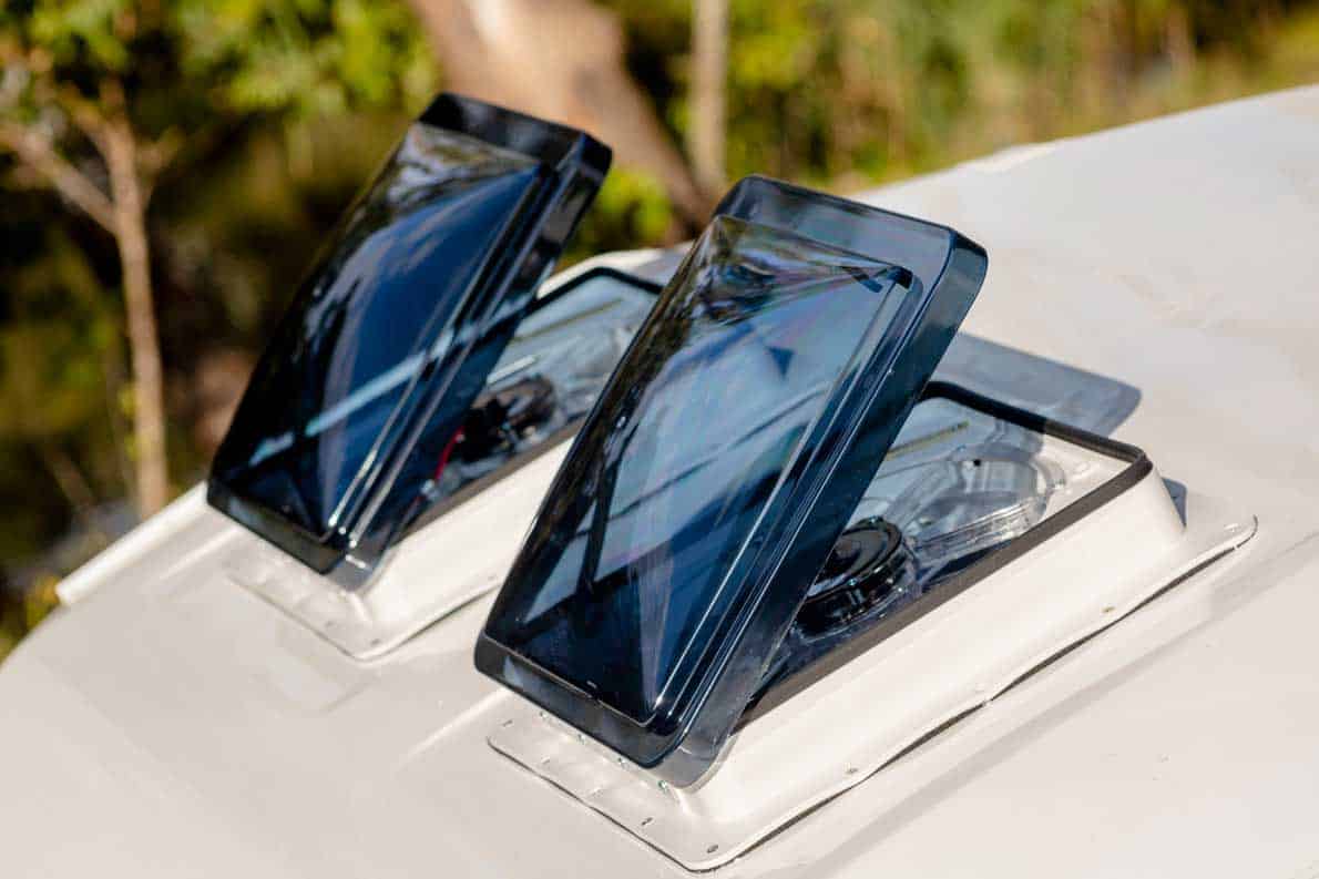 Two cell phones are sitting on top of a table.