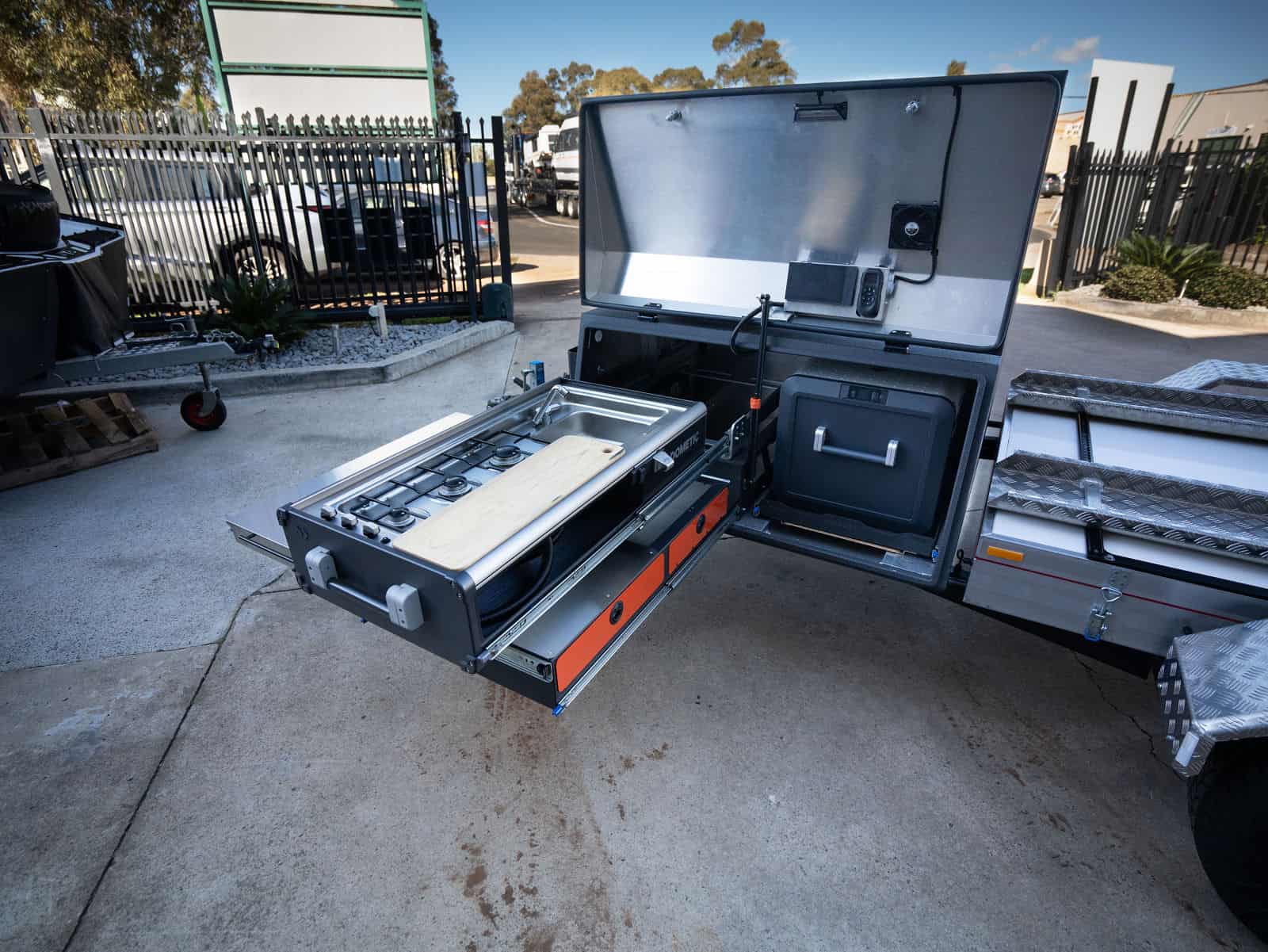 A large oven sitting on top of a metal floor.