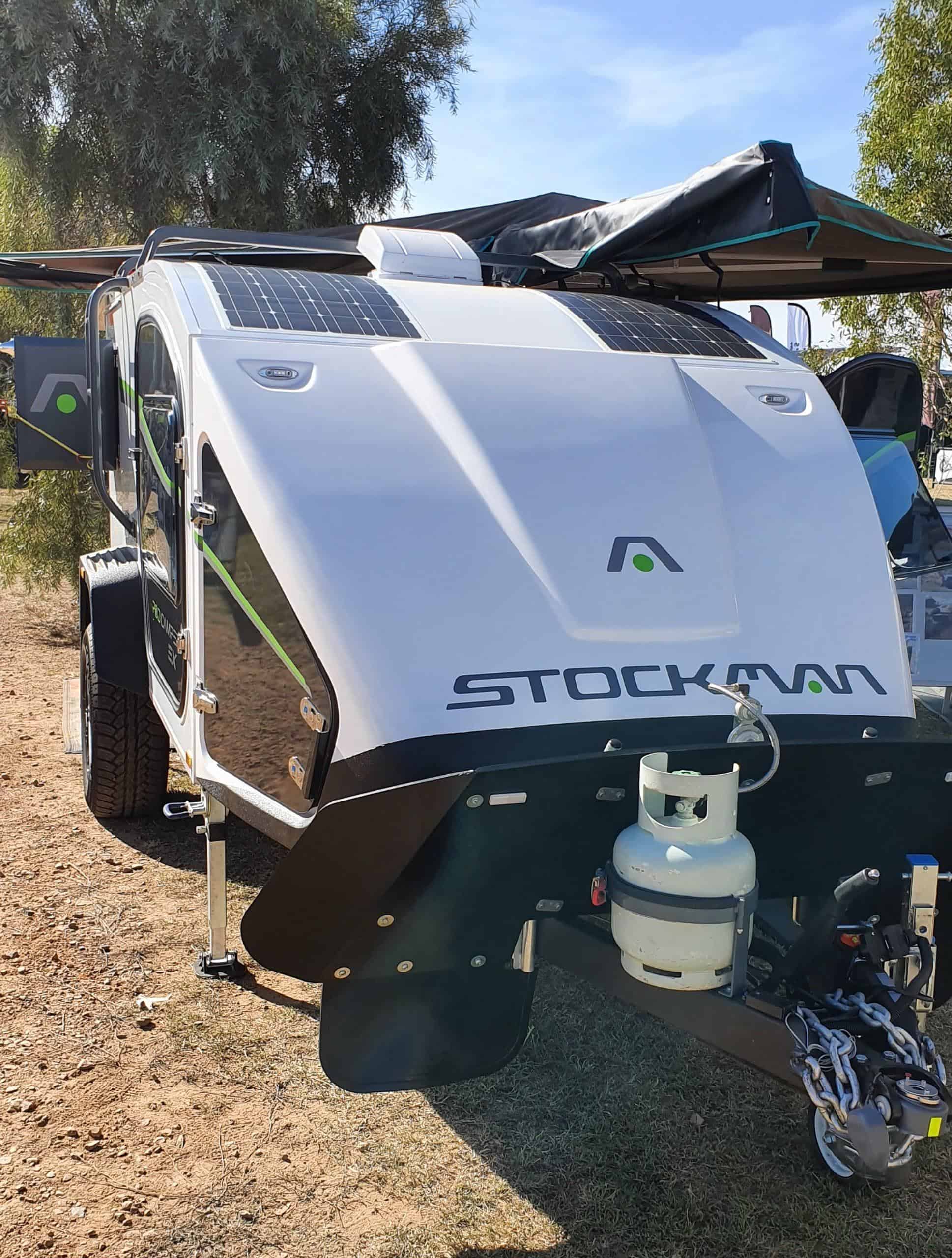 A white boat with a gas tank on top of it.