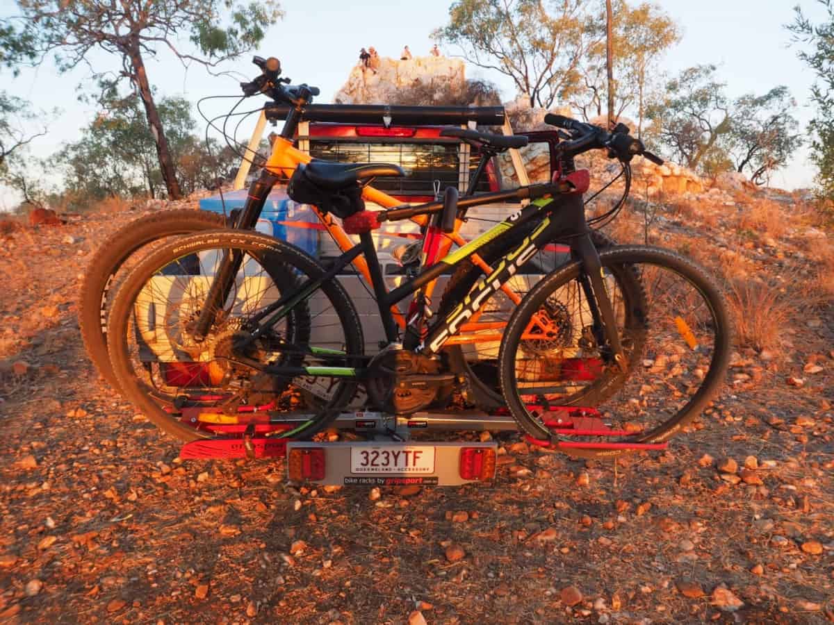 A couple of bikes are parked on the ground