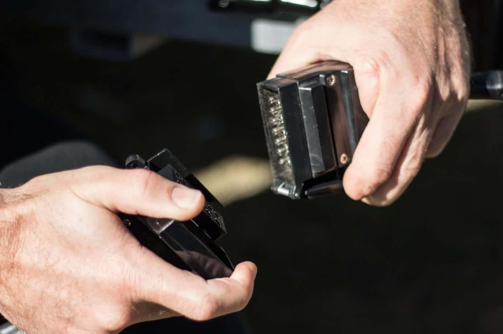 A person holding two different types of electronic devices.